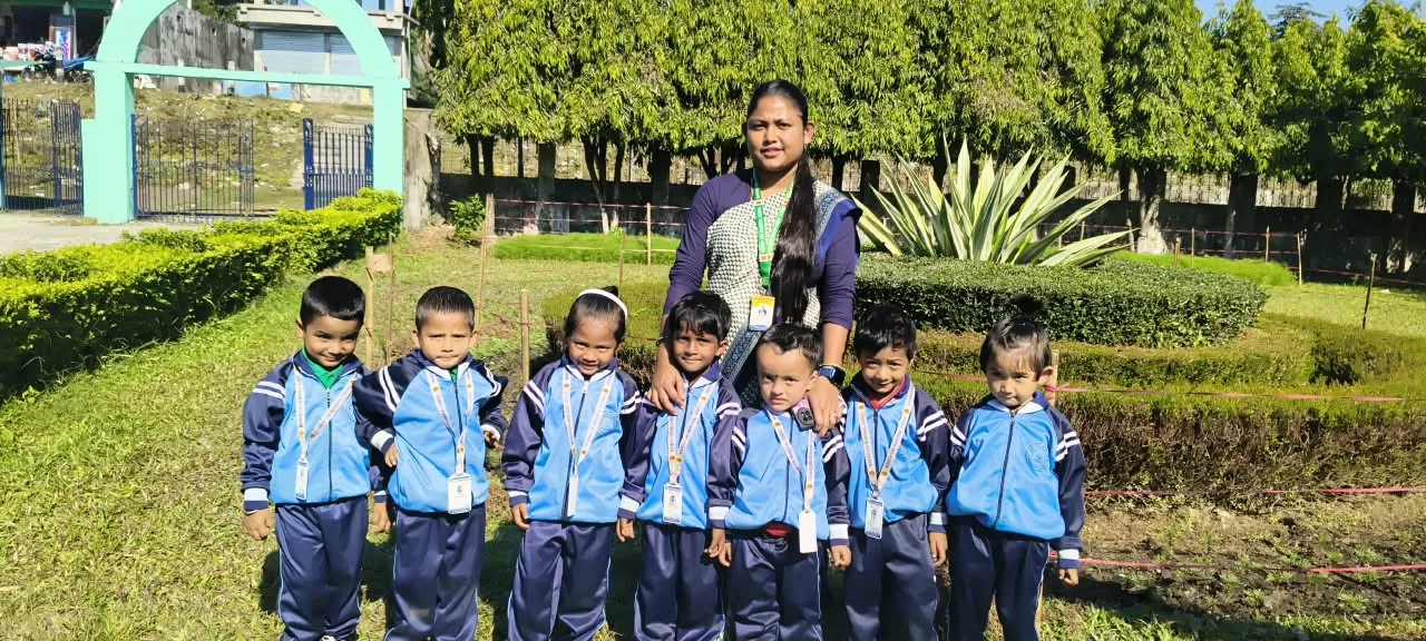 Young MGM pupils with a teacher during an outdoor school activity